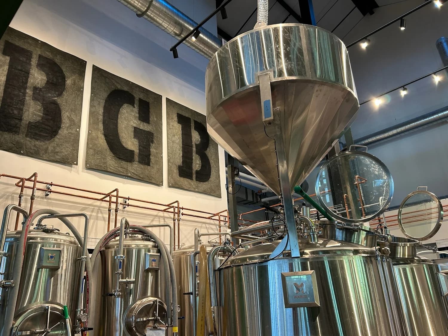 Painted lettering above the brewing tanks at Big Grove Brewery in Omaha
